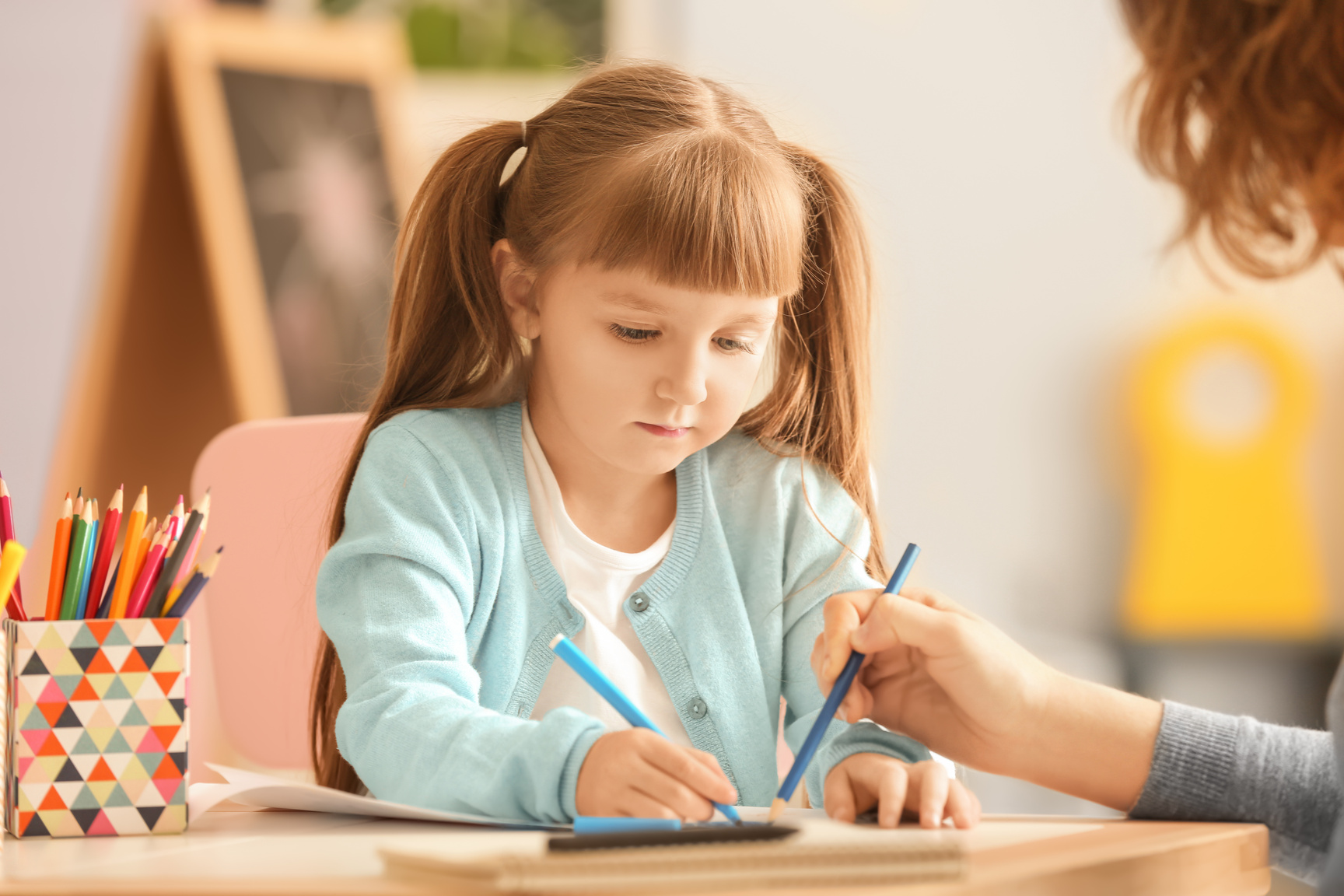  Little Girl with Female Psychologist during Art Therapy